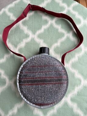 Vintage retro round metal canteen with felt covering